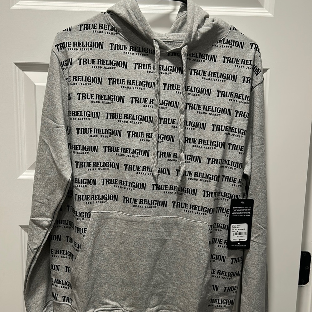 Your teen will love you for this one! Stylish True Religion hoodie! Size medium.